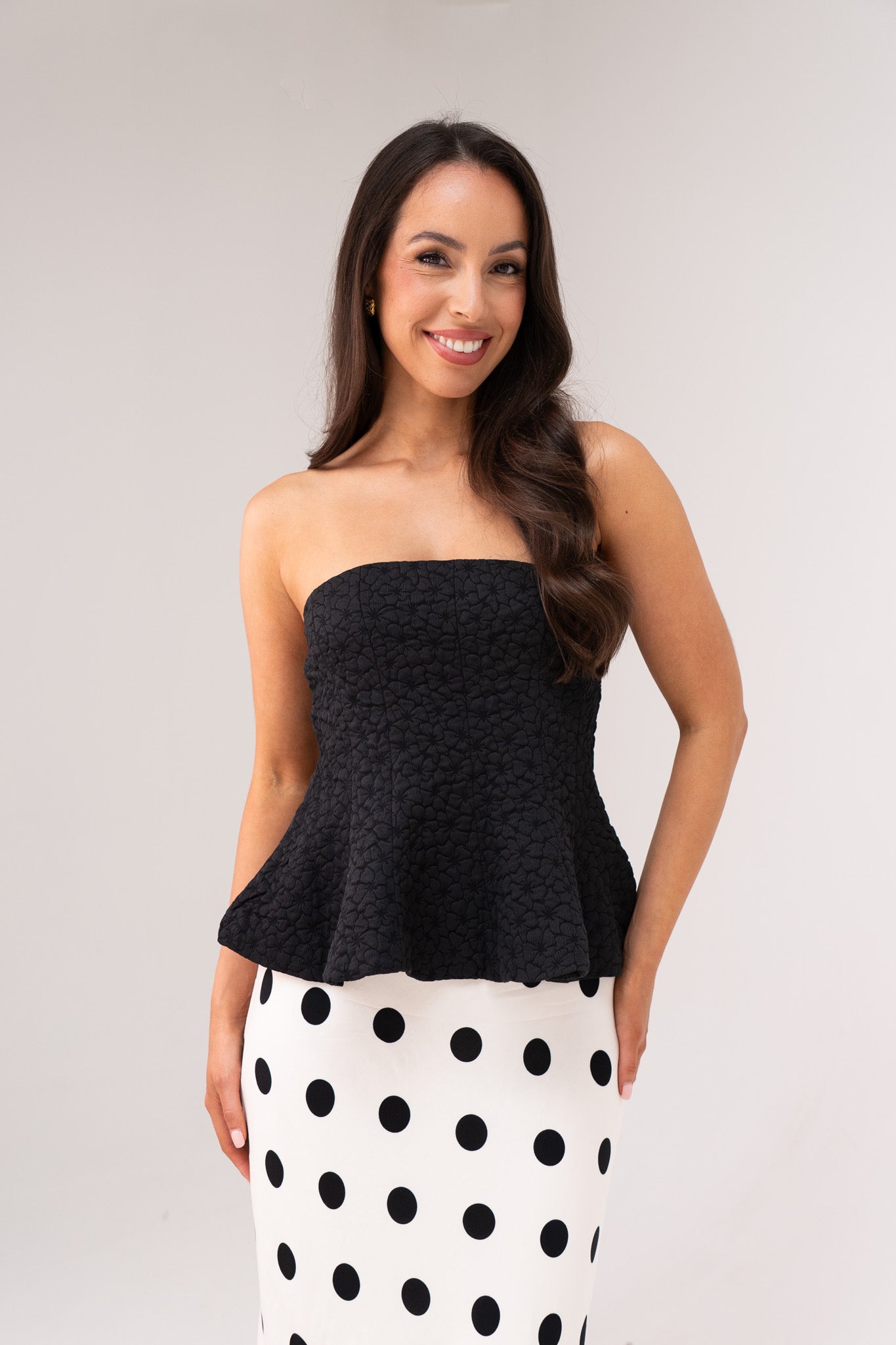 Iris Textured Peplum Top In Black