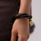 Ruby Twist Bangle In Black