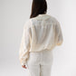 Kendra Tie Neck Ruffle Blouse In Cream