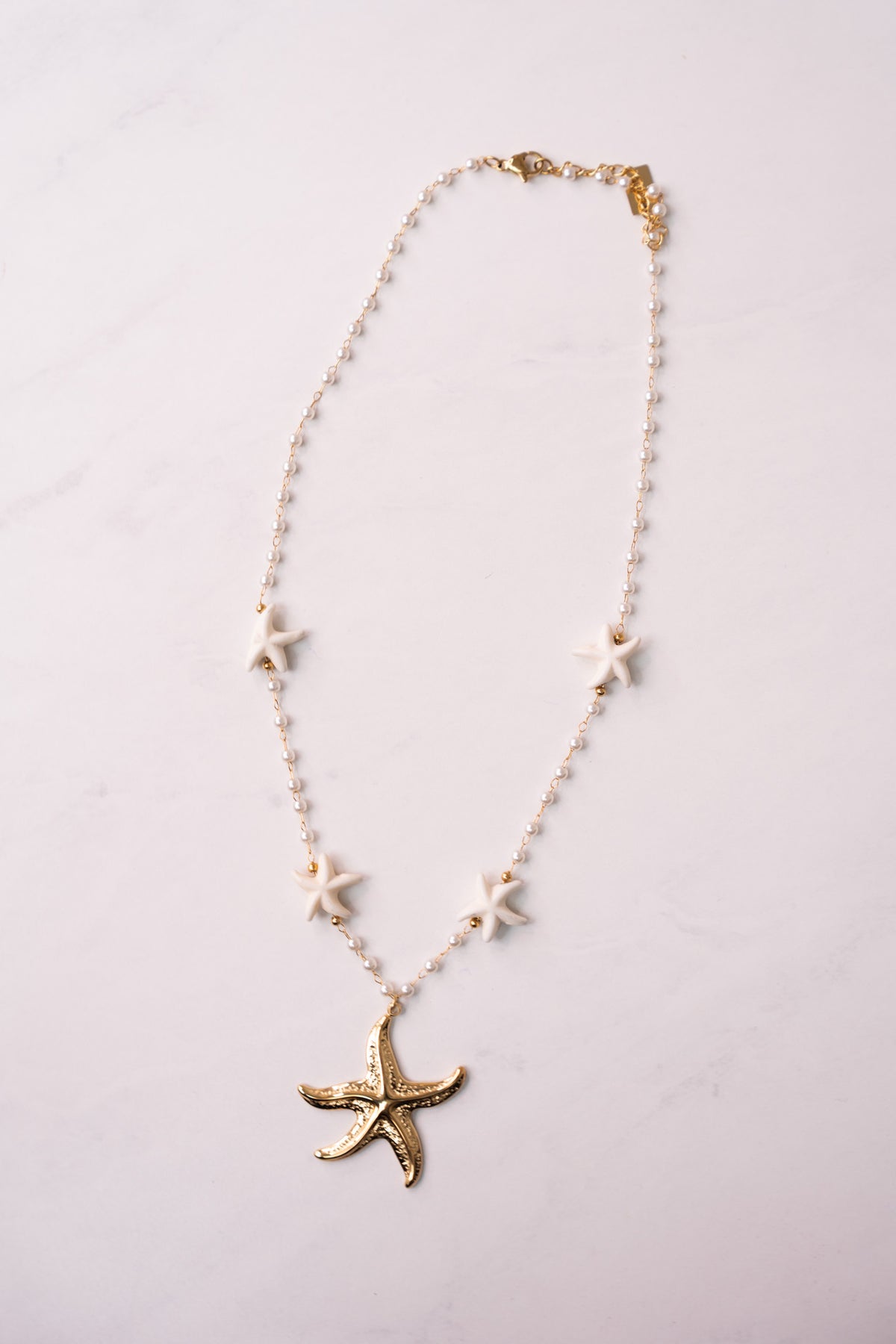 Olive White Beaded Starfish Necklace In Gold