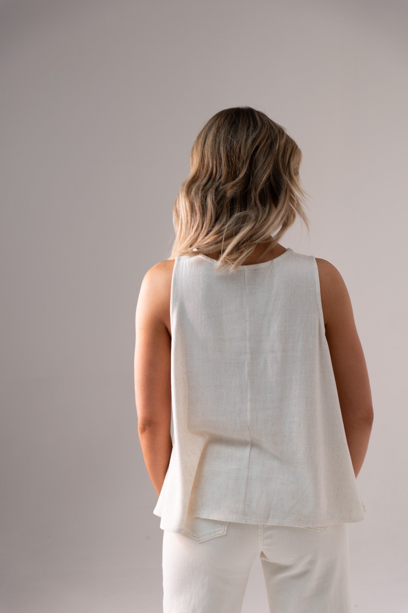 Paige Asymmetric Hem Top In Neutral