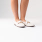 Sadie Buckle Faux Leather Loafer In Cream